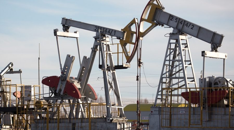 Oil pumping jacks, also known as "nodding donkeys", operate in an oilfield near Almetyevsk, Tatarstan, Russia, on Wednesday, March 11, 2020. Saudi Aramco plans to boost its oil-output capacity for the first time in a decade as the worlds biggest exporter raises the stakes in a price and supply war with Russia and U.S. shale producers. Photographer: Andrey Rudakov/Bloomberg