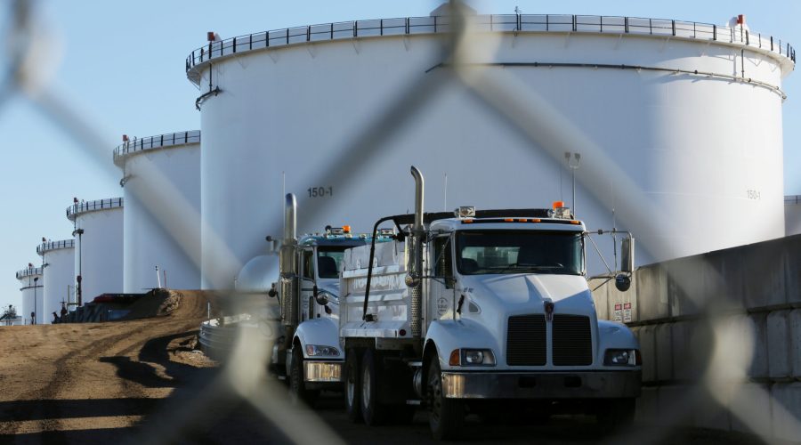 FILE PHOTO --  Dump trucks are parked near crude oil tanks at Kinder Morgan's North 40 terminal expansion construction project in Sherwood Park, near Edmonton, Alberta, Canada November 13, 2016.  REUTERS/Chris Helgren/File Photo